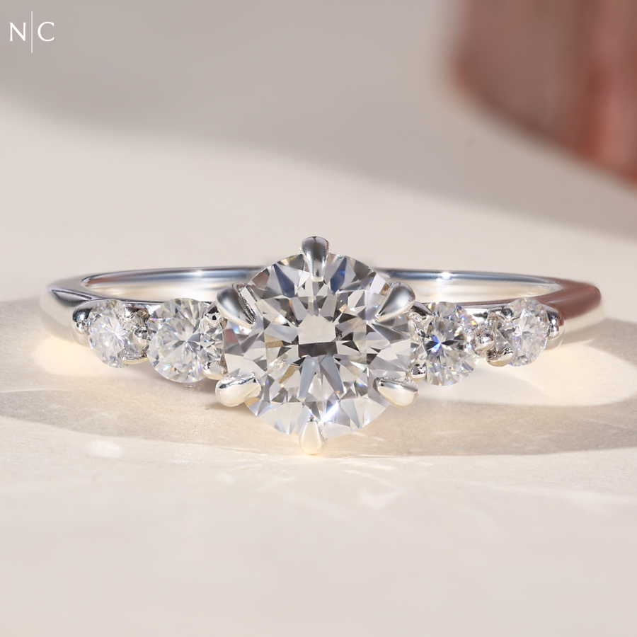 Graduated Round Cut Cascading Side Stone Cluster Ring