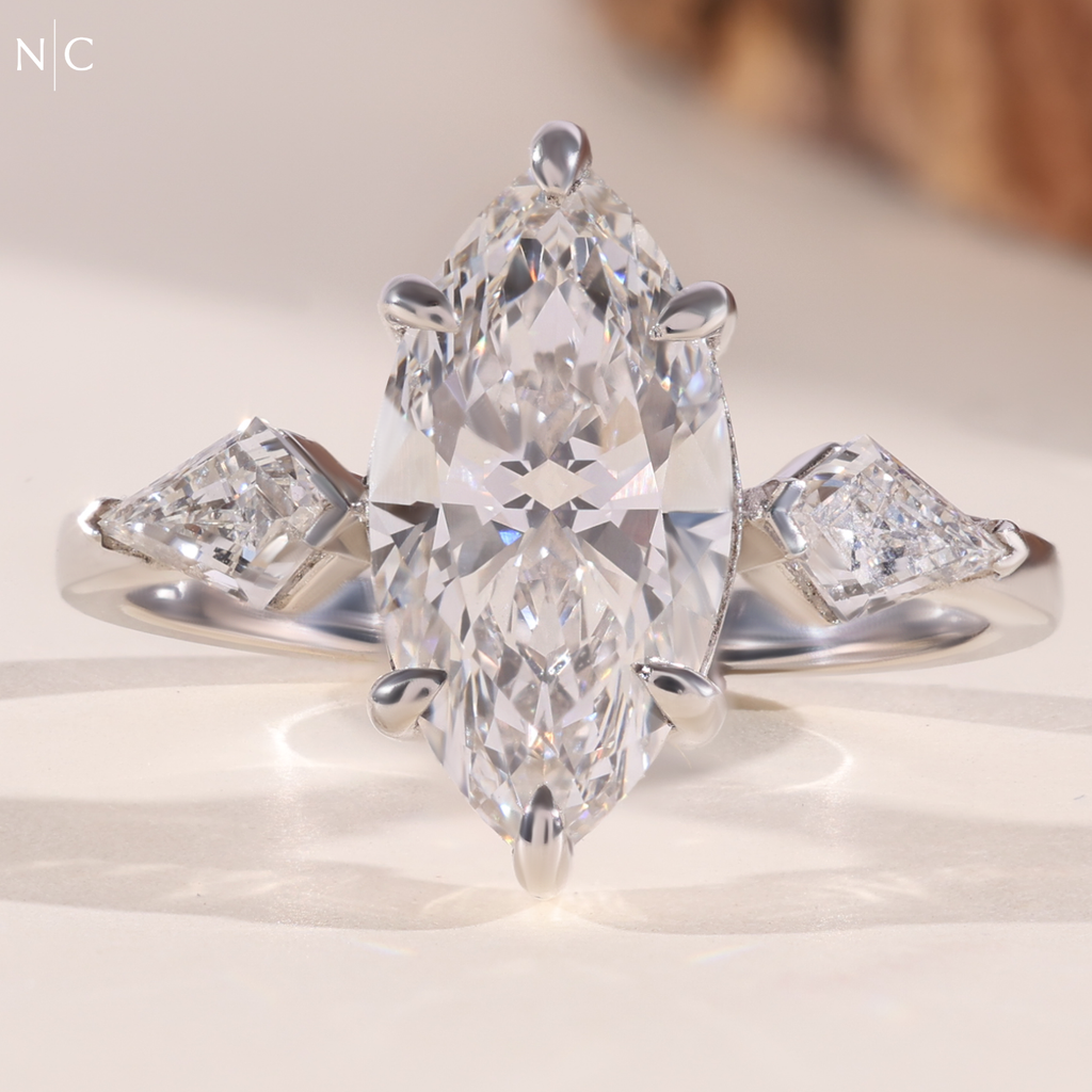 Modern Marquise Kite Side Stone Solitaire Ring