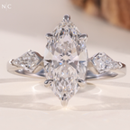 Modern Marquise Kite Side Stone Solitaire Ring