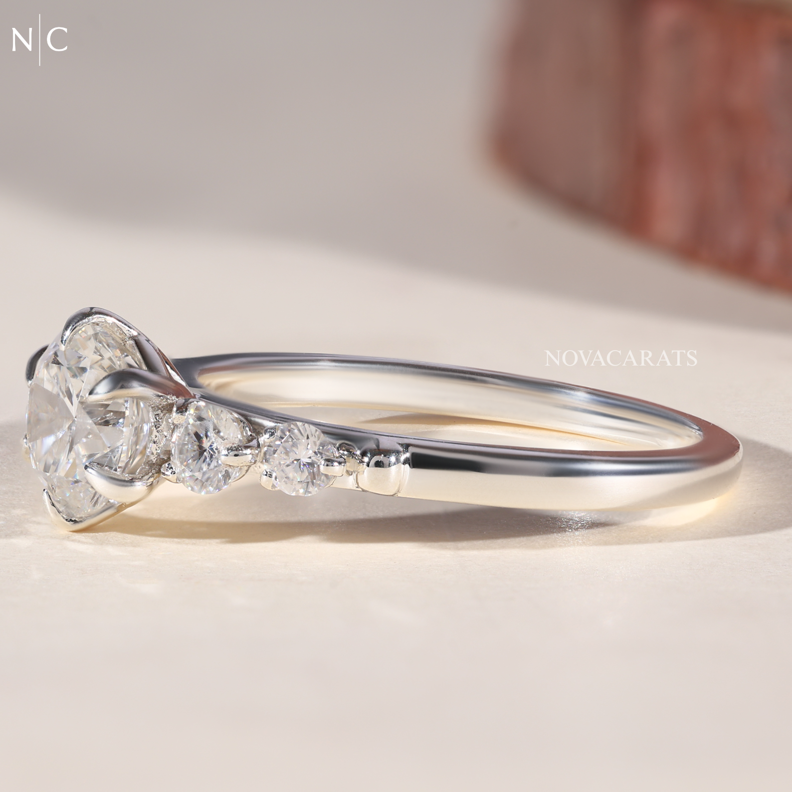 Graduated Round Cut Cascading Side Stone Cluster Ring