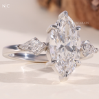 Modern Marquise Kite Side Stone Solitaire Ring