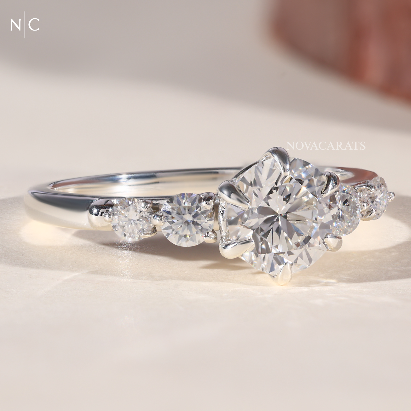 Graduated Round Cut Cascading Side Stone Cluster Ring